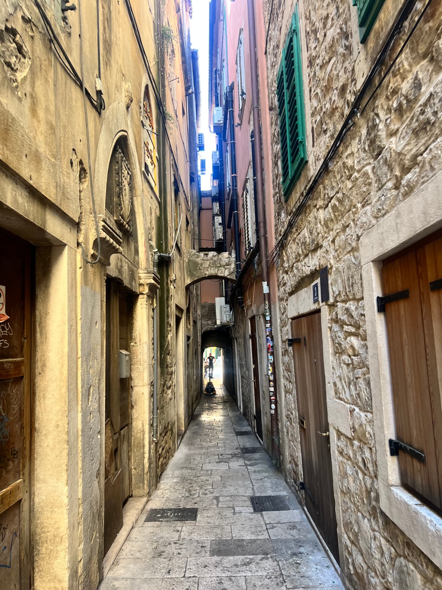 A narrow stone alley in a Croatian old town